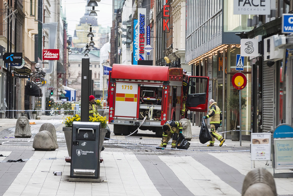STOCKHOLM, SWEDEN - APRIL 08: Fireworkers doing cleanup at the scene of the terrorist truck attack in downtown Stockholm on April 8, 2017 in Stockholm, Sweden. (Photo by Michael Campanella/Getty Images)
