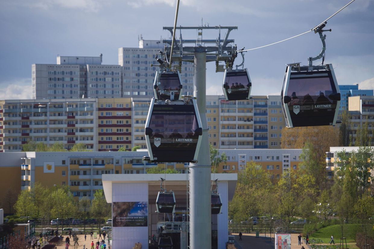 Visitors use a cable car during the International Garden Exhibition (IGA) 2017 at the Gaerten der Welt in Berlin on April 13, 2017. / AFP PHOTO / STEFFI LOOS (Photo credit should read STEFFI LOOS/AFP/Getty Images)