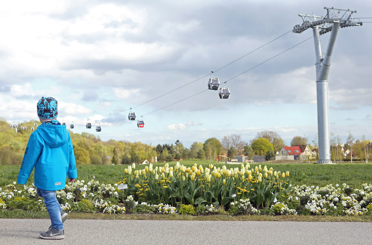 BERLIN, GERMANY - APRIL 13: A child passes tulips growing at the IGA (Internationale Gartenbauausstellung) International Garden Exhibition on April 13, 2017 in Berlin, Germany. The showcase of flora and horticultural design, held every ten years, is being held for the first time in Berlin, and will run from April until October. (Photo by Adam Berry/Getty Images)