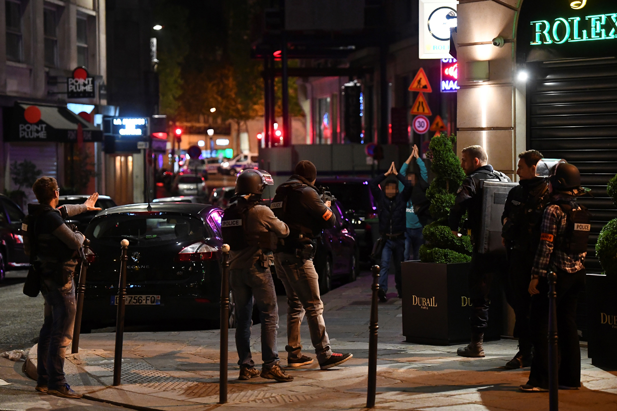 Police officers control passersby near the Champs Elysees in Paris after a shooting on April 20, 2017. One police officer was killed and another wounded today in a shooting on Paris's Champs Elysees, police said just days ahead of France's presidential election. France's interior ministry said the attacker was killed in the incident on the world famous boulevard that is popular with tourists. / AFP PHOTO / FRANCK FIFE (Photo credit should read FRANCK FIFE/AFP/Getty Images)
