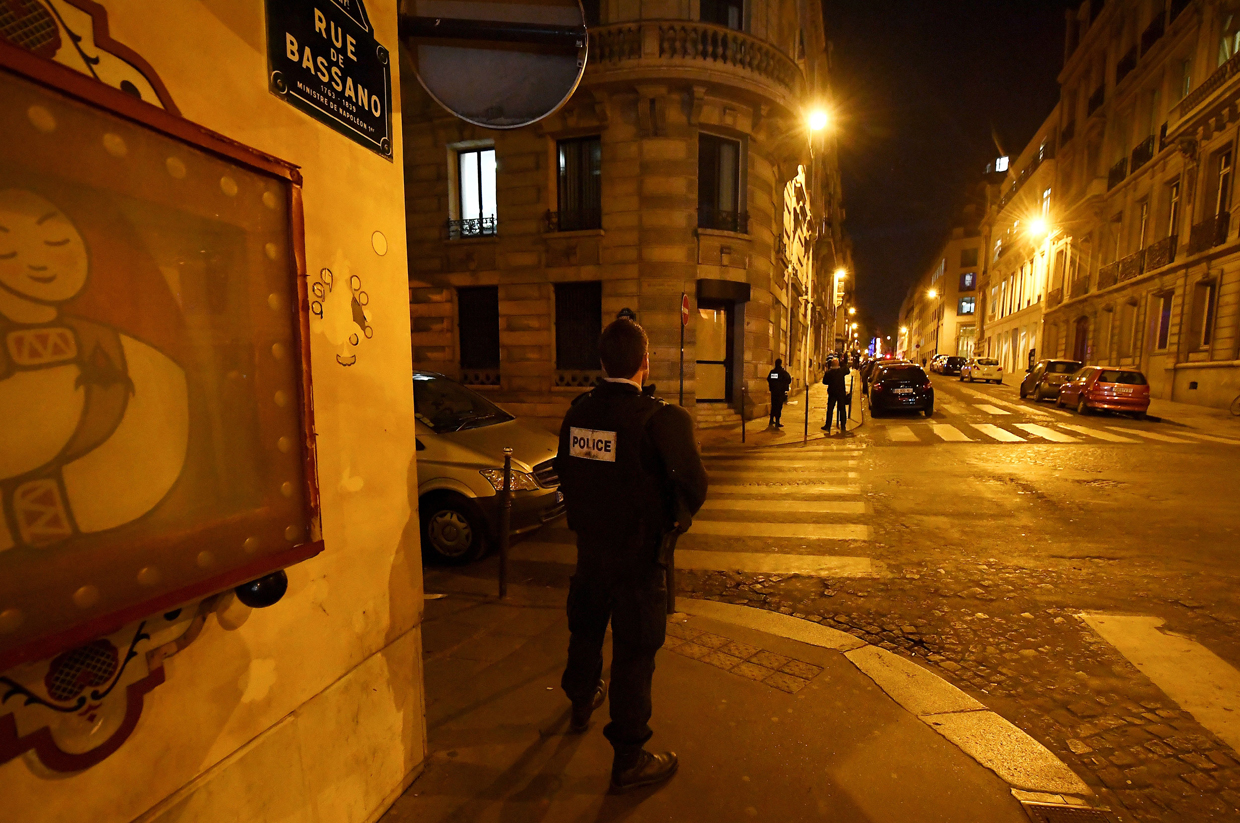 A police officers stands guard on rue de Bassano, near the site of a shooting on the Champs Elysees avenue in Paris on April 20, 2017. A gunman opened fire on police on the Champs Elysees, killing a policeman and wounding two others in an attack claimed by the Islamic State group just days before the first round of the presidential election. / AFP PHOTO / FRANCK FIFE (Photo credit should read FRANCK FIFE/AFP/Getty Images)