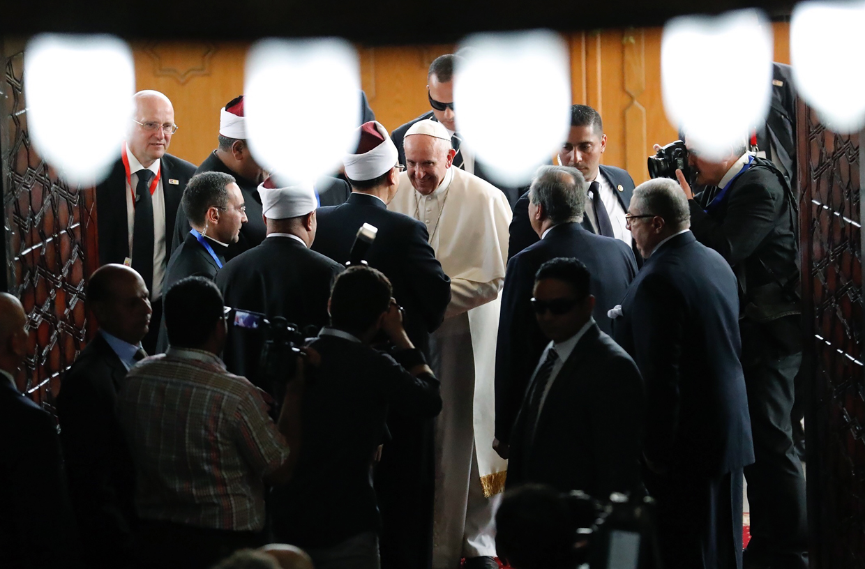 Pope Francis (C) is greeted by Muslim clerics at the prestigious Sunni institution Al-Azhar in Cairo on April 28, 2017, during an official visit to Egypt. Pope Francis began a visit to Egypt to promote "unity and fraternity" among Muslims and the embattled Christian minority that has suffered a series of jihadist attacks. / AFP PHOTO / Thomas COEX (Photo credit should read THOMAS COEX/AFP/Getty Images)