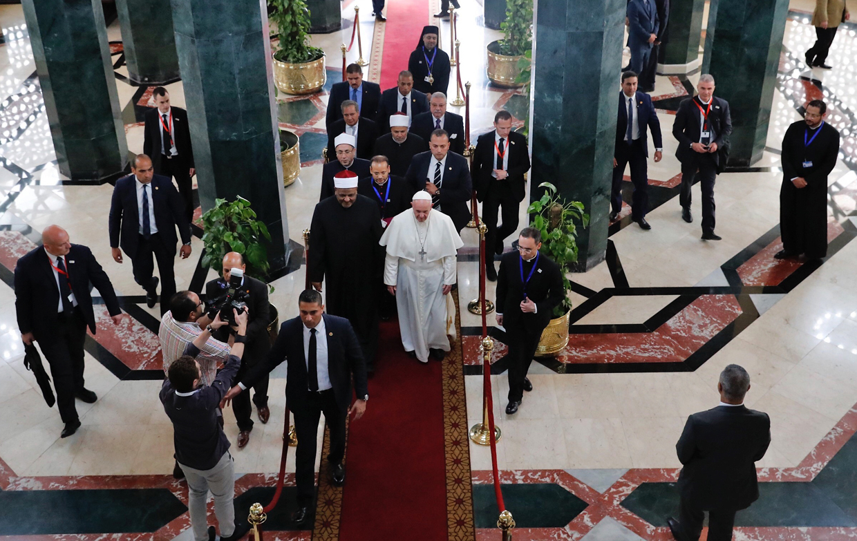 Pope Francis (C-R) walks alongside Muslim clerics at the prestigious Sunni institution Al-Azhar in Cairo on April 28, 2017, during an official visit to Egypt. Pope Francis began a visit to Egypt to promote "unity and fraternity" among Muslims and the embattled Christian minority that has suffered a series of jihadist attacks. / AFP PHOTO / Thomas COEX (Photo credit should read THOMAS COEX/AFP/Getty Images)