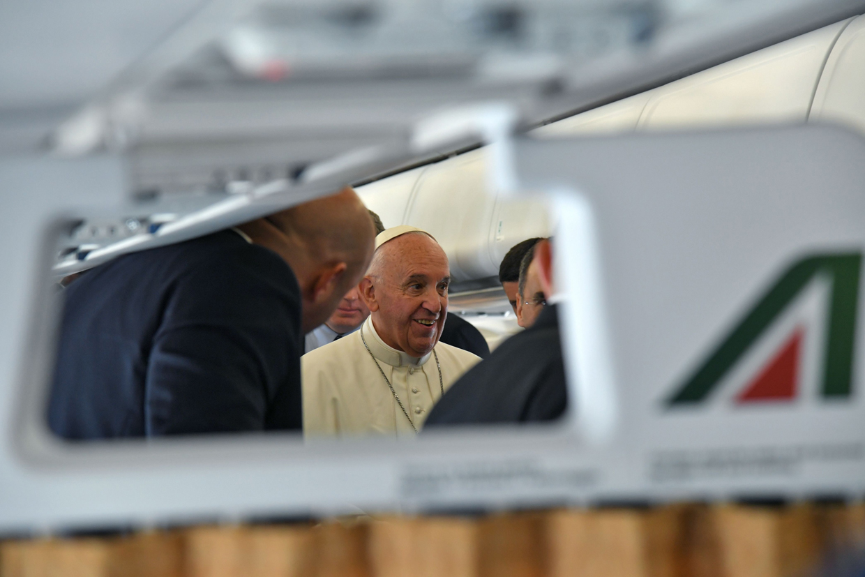 Pope Francis speaks from aboard his plane bound to Cairo from Rome, on April 28, 2017. Pope Francis began a visit to Egypt to promote "unity and fraternity" among Muslims and the embattled Christian minority that has suffered a series of jihadist attacks. / AFP PHOTO / POOL / Andreas SOLARO (Photo credit should read ANDREAS SOLARO/AFP/Getty Images)