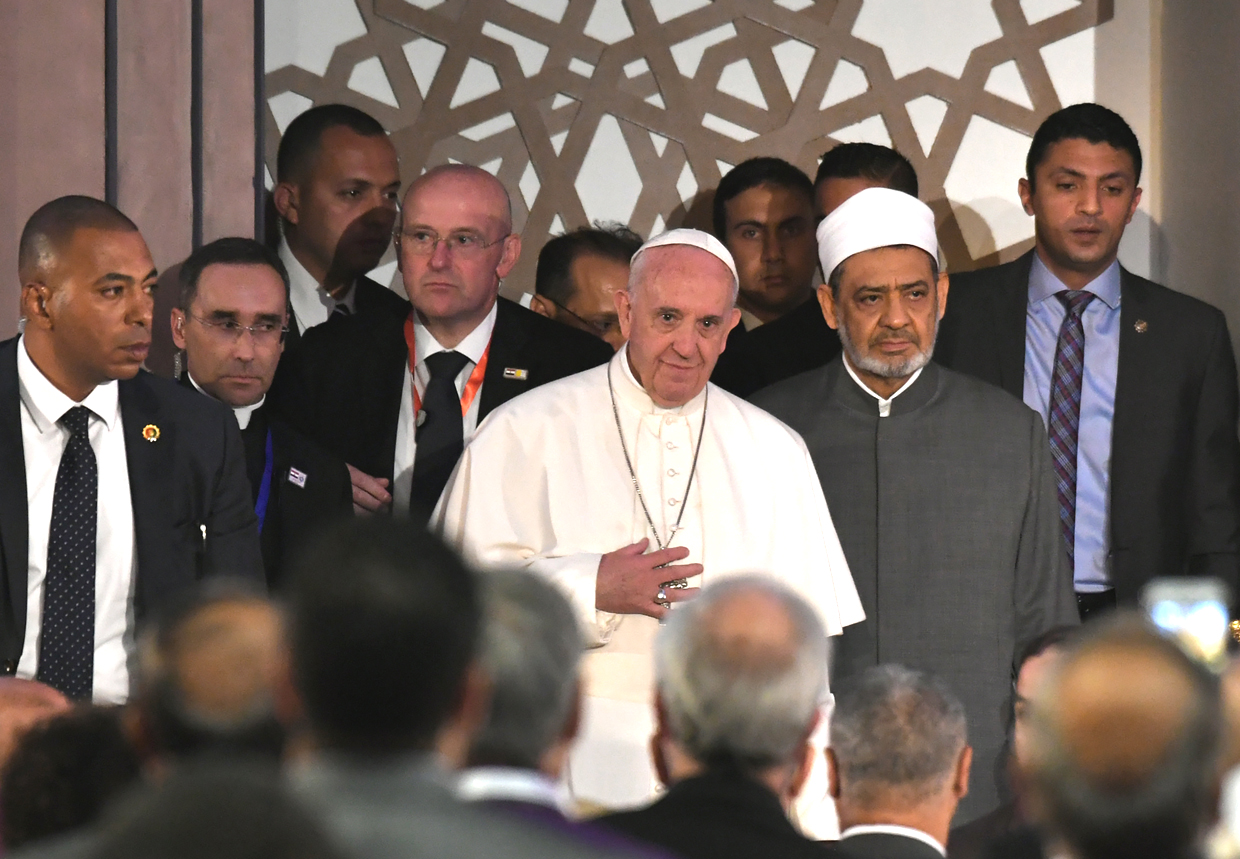 Pope Francis (C) stands next to Sheikh Ahmed al-Tayeb (C-R), the Grand Imam of Al-Azhar, during a visit to the prestigious Sunni institution in Cairo on April 28, 2017. Pope Francis began a visit to Egypt to promote "unity and fraternity" among Muslims and the embattled Christian minority that has suffered a series of jihadist attacks. / AFP PHOTO / Andreas SOLARO (Photo credit should read ANDREAS SOLARO/AFP/Getty Images)