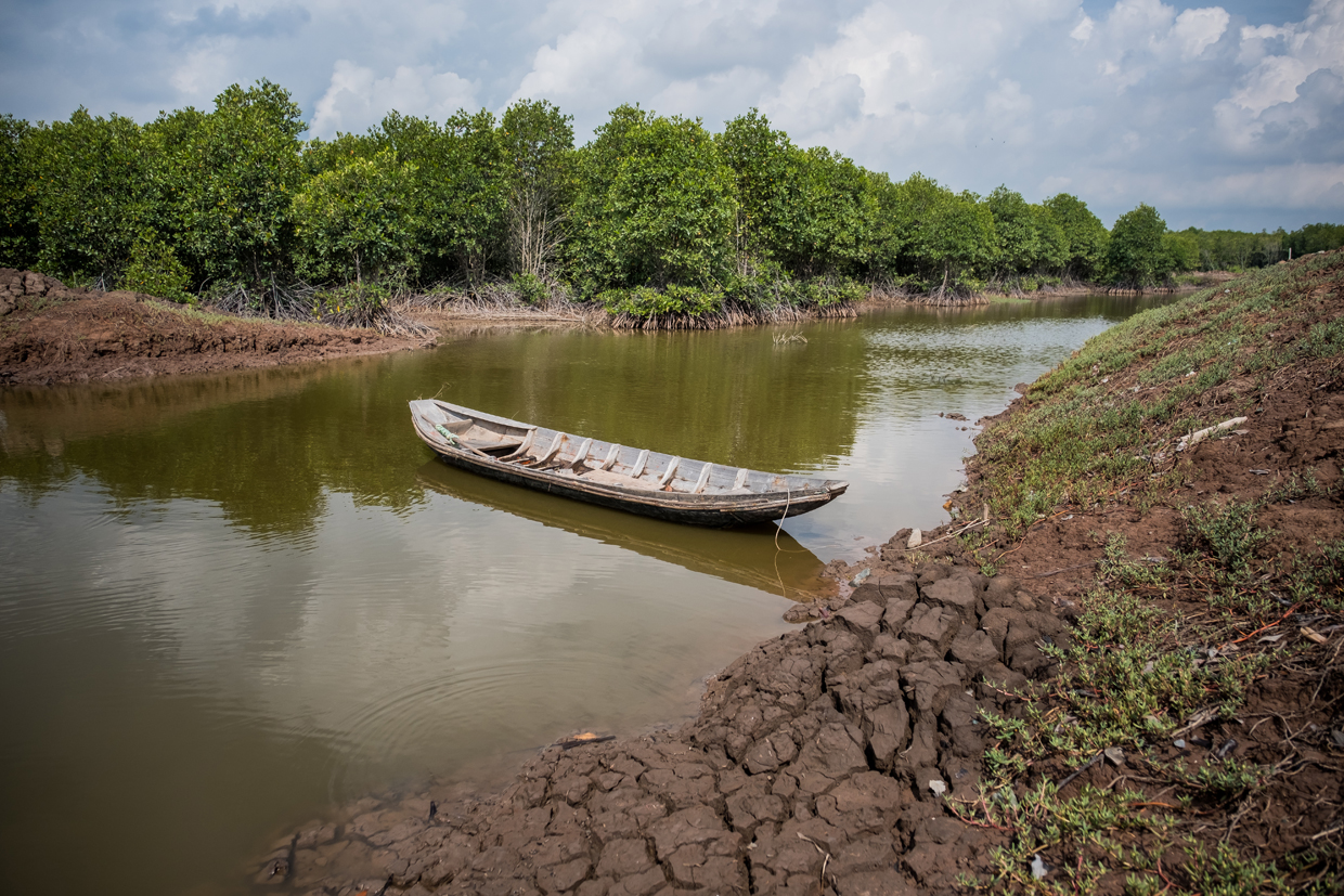 BEN TRE, VIETNAM - APRIL 29: Landscape of a briny water cananl on April 29, 2017 in Bao Thuan Village, Ba Tri District, Ben Tre Province, Vietnam. The Mekong River Delta is amongst the most vulnerable regions in South Vietnam, which is home to more than 17 million people and produces around half of the country's rice harvest with its fertile fields. However, climate change is causing the rise of salt content of water in land that has ben used for rice paddies, coconut groves and other crops, threatening the livelihoods of millions of farmers and fishermen. The Vietnamese government report have stated that 40 percent of the delta could be submerged if sea levels rise by one-meter in decades to come while residents in the low-lying delta have already been affected by more frequent typhoons and heavier floods that could potentially drive hundreds of thousands of people from their homes, according to reports. As many locals have been forced to abandon their rice cultivation due to salinization and risk their livelihood on other ventures such as shrimp farming, reports also state that cycles and storms linked to climate change would not only risk the Mekong Delta, but also up to the coffee crops in the highlands as well as the Red River Delta in the north, affecting large areas near the country's capital, Hanoi. (Photo by Linh Pham/Getty Images)