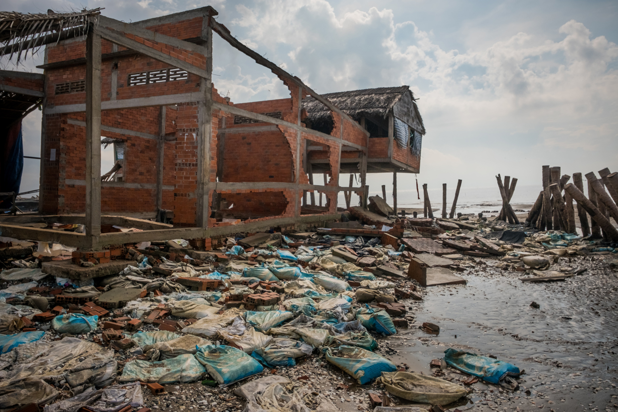 BEN TRE, VIETNAM - APRIL 29: A cafe was destroyed bt the high tides near the seafront on around February 2017, photographed on April 29, 2017 in Bao Thuan Village, Ba Tri District, Ben Tre Province, Vietnam. The Mekong River Delta is amongst the most vulnerable regions in South Vietnam, which is home to more than 17 million people and produces around half of the country's rice harvest with its fertile fields. However, climate change is causing the rise of salt content of water in land that has ben used for rice paddies, coconut groves and other crops, threatening the livelihoods of millions of farmers and fishermen. The Vietnamese government report have stated that 40 percent of the delta could be submerged if sea levels rise by one-meter in decades to come while residents in the low-lying delta have already been affected by more frequent typhoons and heavier floods that could potentially drive hundreds of thousands of people from their homes, according to reports. As many locals have been forced to abandon their rice cultivation due to salinization and risk their livelihood on other ventures such as shrimp farming, reports also state that cycles and storms linked to climate change would not only risk the Mekong Delta, but also up to the coffee crops in the highlands as well as the Red River Delta in the north, affecting large areas near the country's capital, Hanoi. (Photo by Linh Pham/Getty Images)