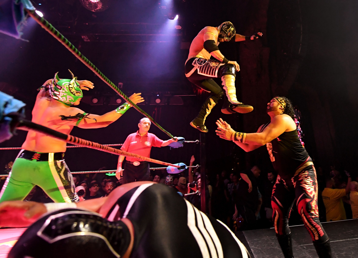 Nacho Libre wresters perform during a special Cinco de Mayo show by the Lucha Vavoom ensemble in Los Angeles, California on May 4, 2017. Cinco de Mayo commemorates the Mexican Army's unexpected victory over French forces in 1862. In the US the festival is a celebration of Mexican-American culture. / AFP PHOTO / Mark RALSTON (Photo credit should read MARK RALSTON/AFP/Getty Images)