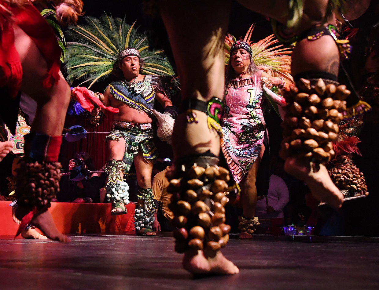 Aztec dancers perform during a special Cinco de Mayo show by the Lucha Vavoom ensemble in Los Angeles, California on May 4, 2017. Cinco de Mayo commemorates the Mexican Army's unexpected victory over French forces in 1862. In the US the festival is a celebration of Mexican-American culture. / AFP PHOTO / Mark RALSTON (Photo credit should read MARK RALSTON/AFP/Getty Images)