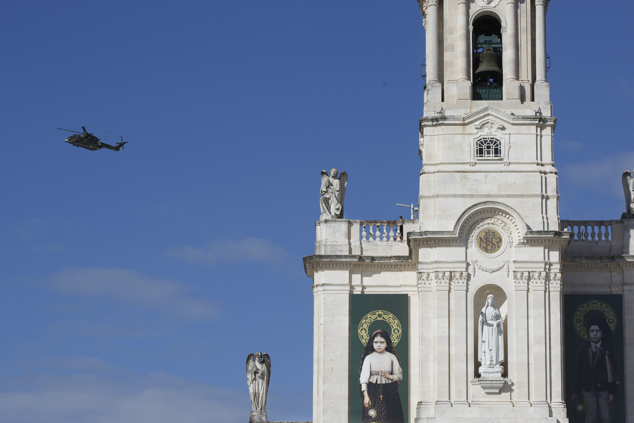 FATIMA, PORTUGAL - MAY 12: Pope Francis' helicopter flies over the Sanctuary of Fatima on May 12, 2017 in Fatima, Portugal. Pope Francis will be attending the Sanctuary of Fatima, in Portugal, on May 12 and 13 to canonize two Portuguese shepherds, Jacinta and Francisco Marto, who are said to have witnessed the apparition of what they believed was the Virgin Mary, together with their aunt Lucia Santos, during the 100 anniversary of the event. Thousands of pilgrims and worshippers from around the world are expected to gather at the centenary celebration. (Photo by Pablo Blazquez Dominguez/Getty Images)