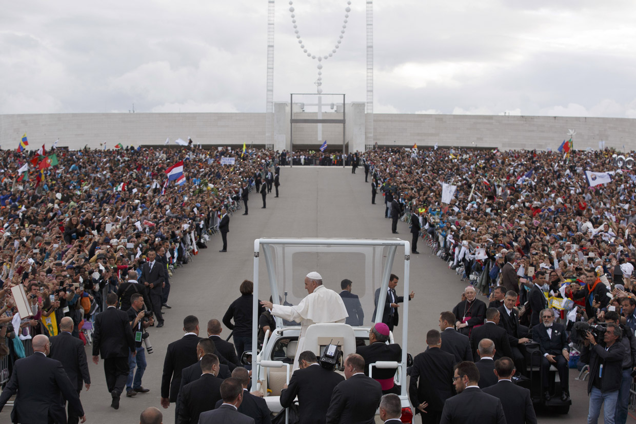 FATIMA, PORTUGAL - MAY 12: Pope Francis waves as he leaves the Sanctuary of Fatima on May 12, 2017 in Fatima, Portugal. Pope Francis will be attending the Sanctuary of Fatima, in Portugal, on May 12 and 13 to canonize two Portuguese shepherds, Jacinta and Francisco Marto, who are said to have witnessed the apparition of what they believed was the Virgin Mary, together with their aunt Lucia Santos, during the 100 anniversary of the event. Thousands of pilgrims and worshippers from around the world are expected to gather at the centenary celebration. (Photo by Pablo Blazquez Dominguez/Getty Images)