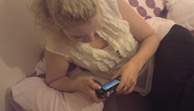 women texting in bed