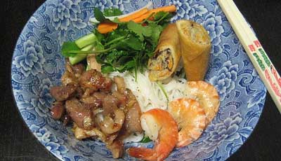 Bun thit heo nuong, tom, cha gio (Vietnamese rice vermicelli voodles with grilled pork, shrimp, and egg rolls)