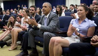 U.S. President Barack Obama watches the U.S. play Belgium in World Cup action