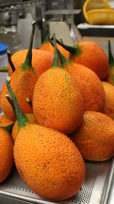The "gac" fruit is used to tint and flavor several desserts, including xoi and che